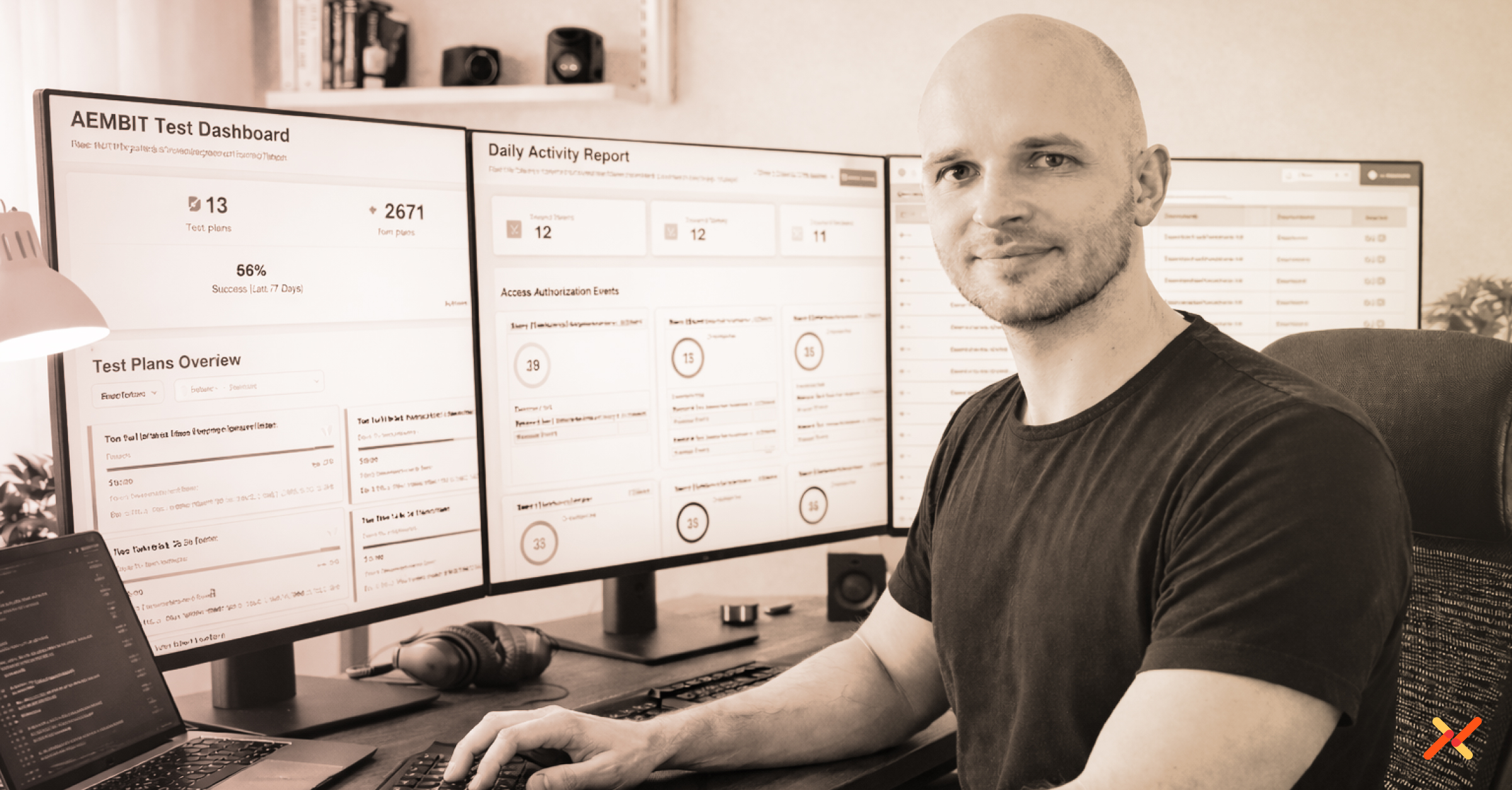 Aembit engineer Sebastian working on computers while looking at camera.