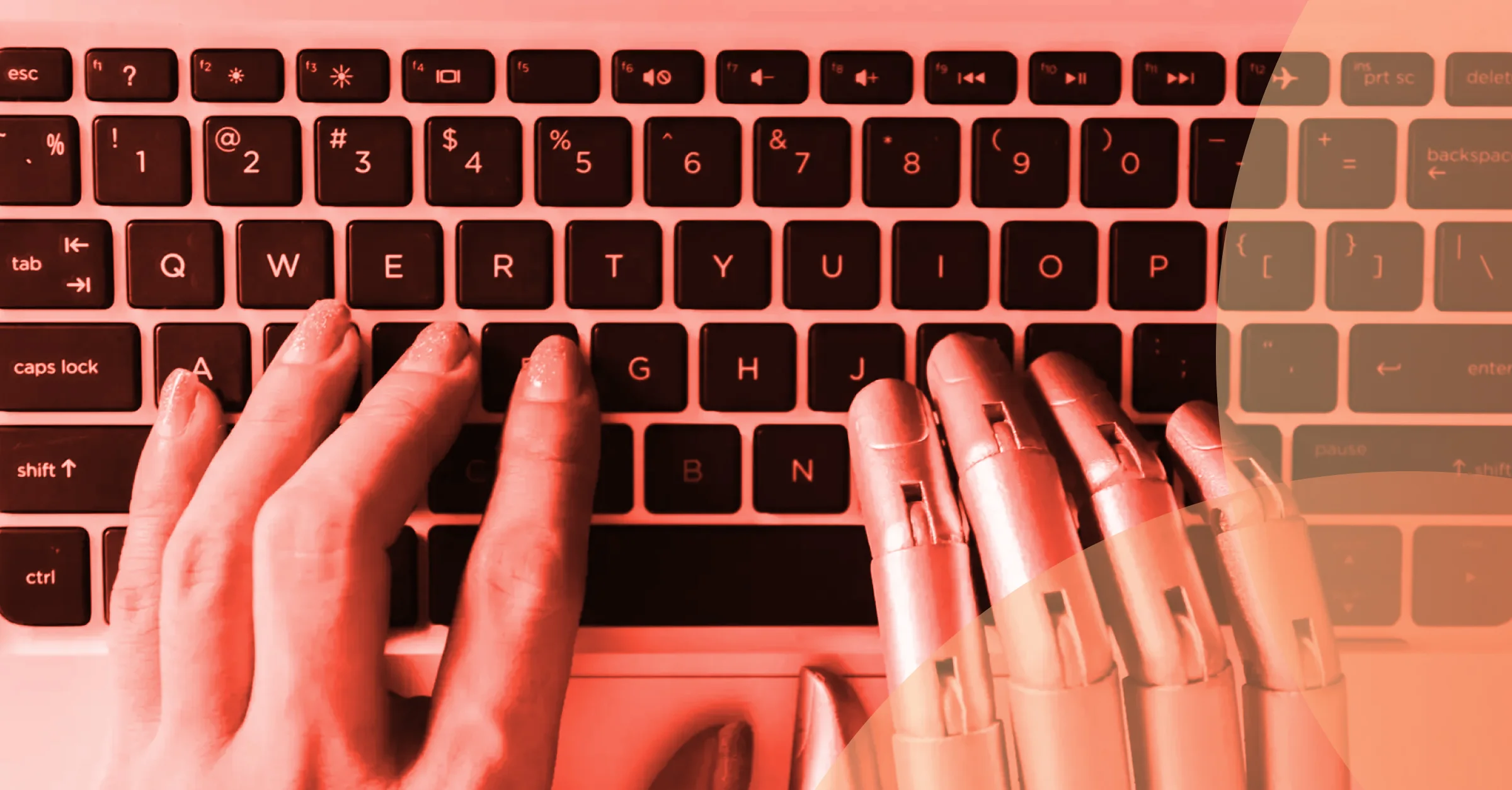 human and robot hands at computer