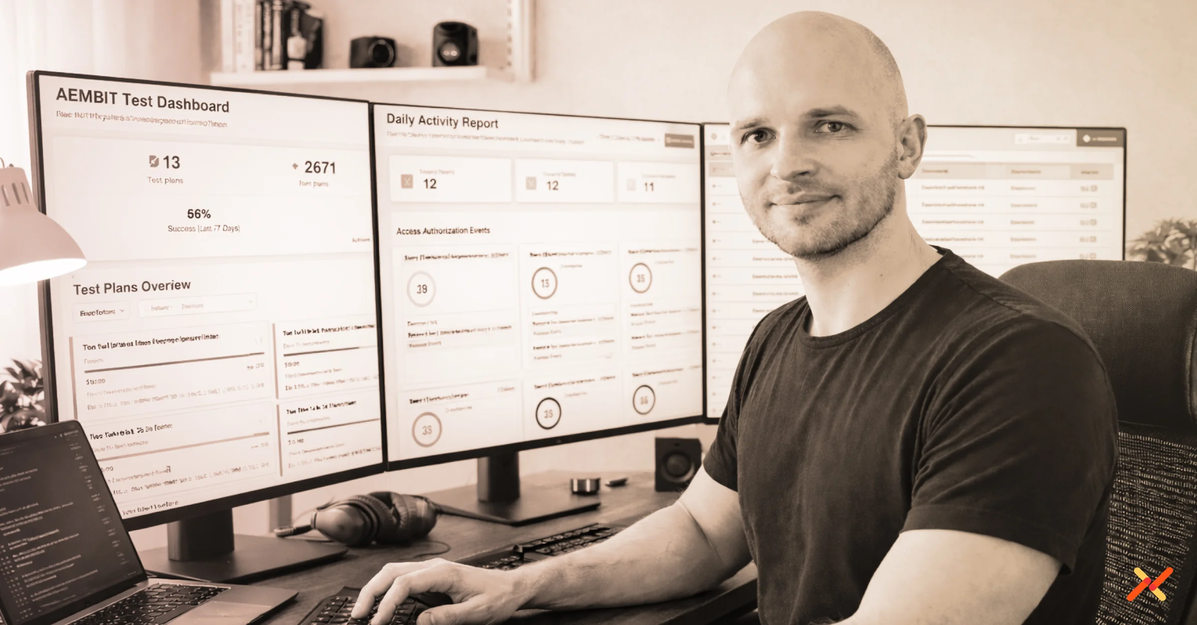 Aembit engineer Sebastian working on computers while looking at camera.