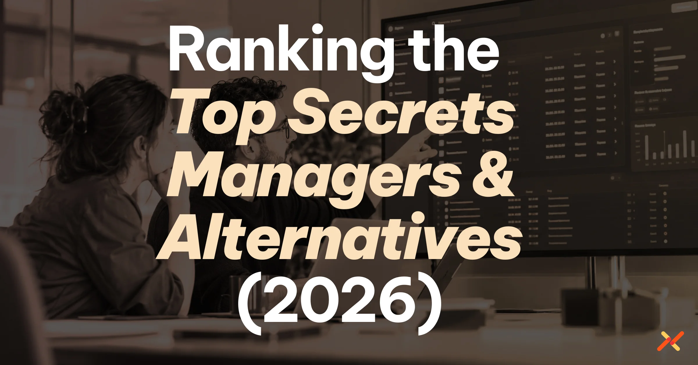 Two professionals reviewing a secrets management dashboard, with text reading “Ranking the Top Secrets Managers & Alternatives (2026).